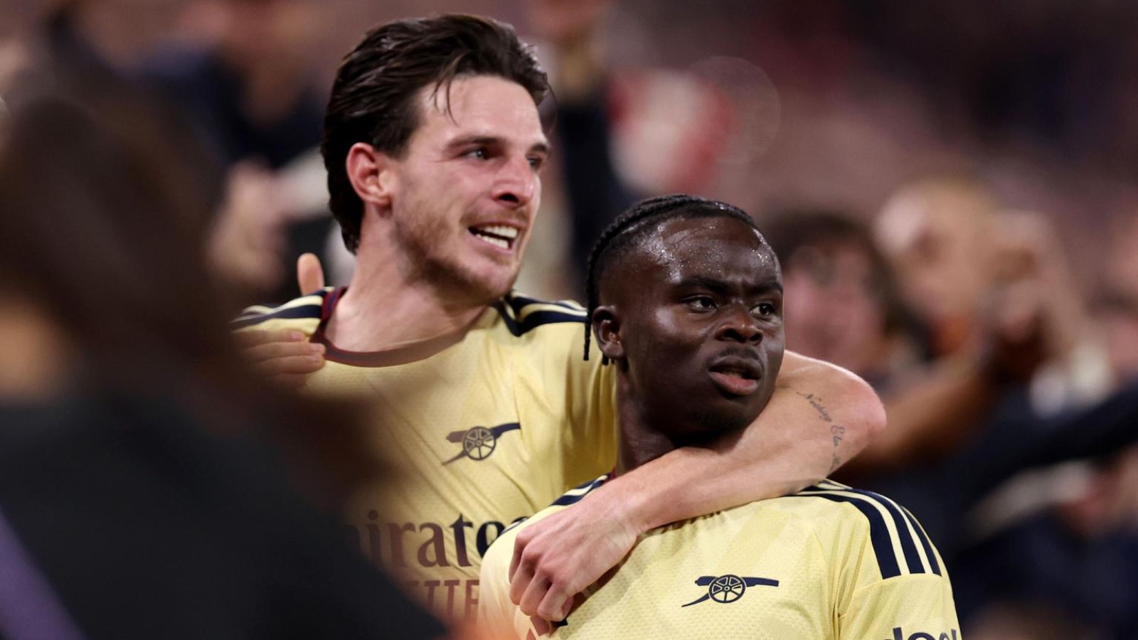 Bukayo Saka and Declan Rice celebrate at Villa Park