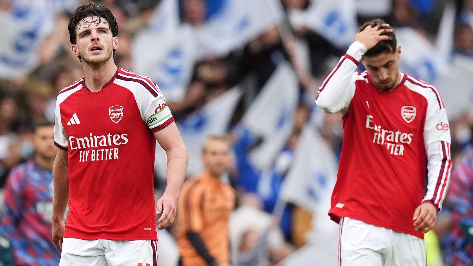 Two Arsenal players look dejected at the Amex