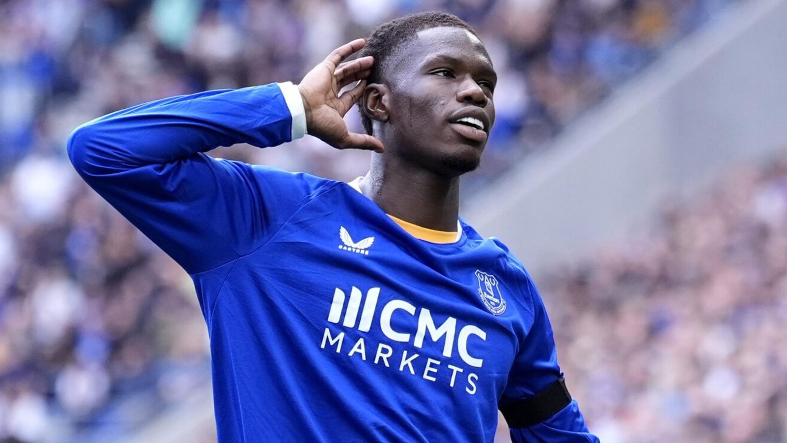 An Everton player cups his ear to the crowd at Hill Dickinson Stadium