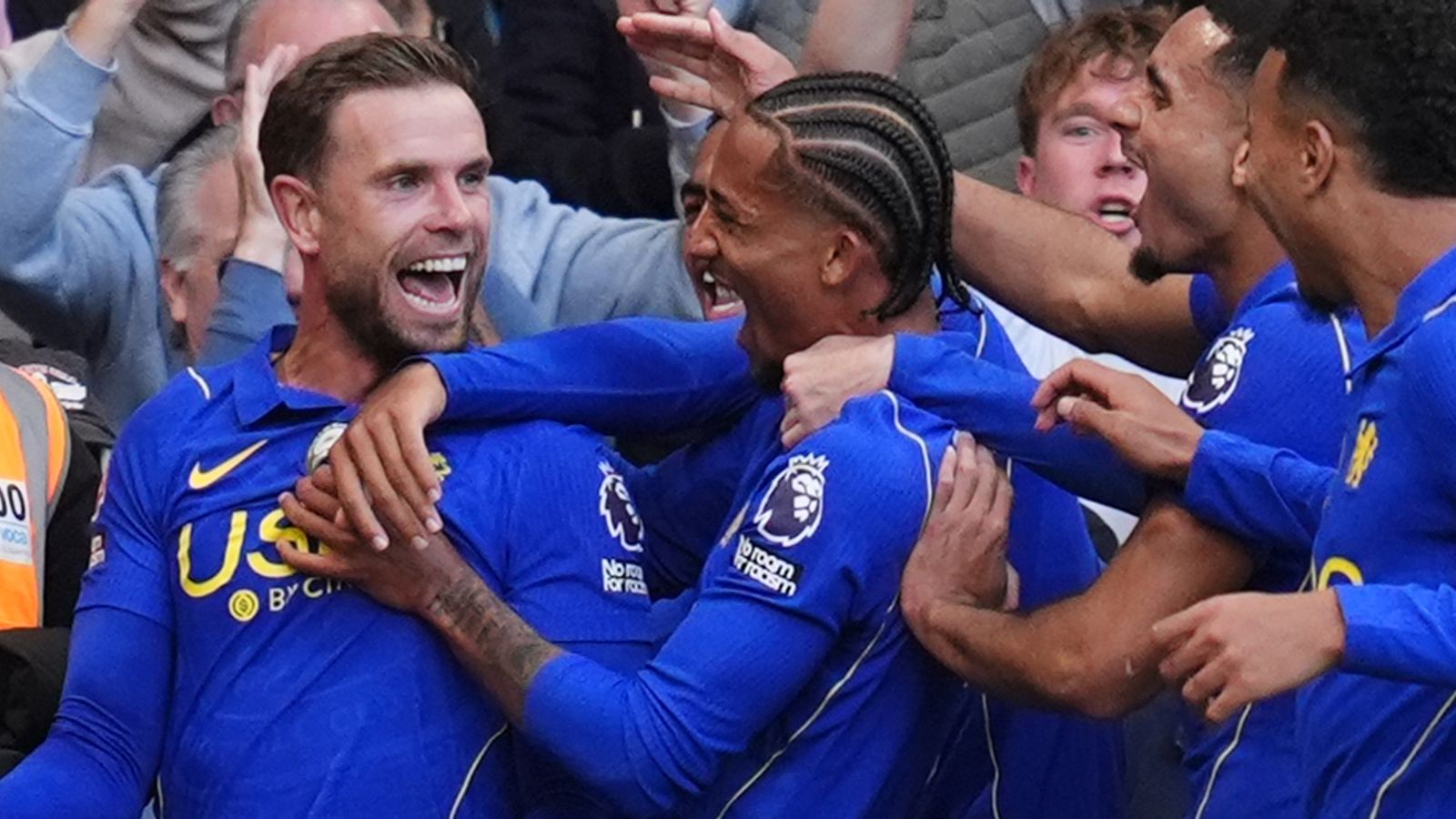 Chelsea’s Jordan Henderson celebrates with teammates at Stamford Bridge