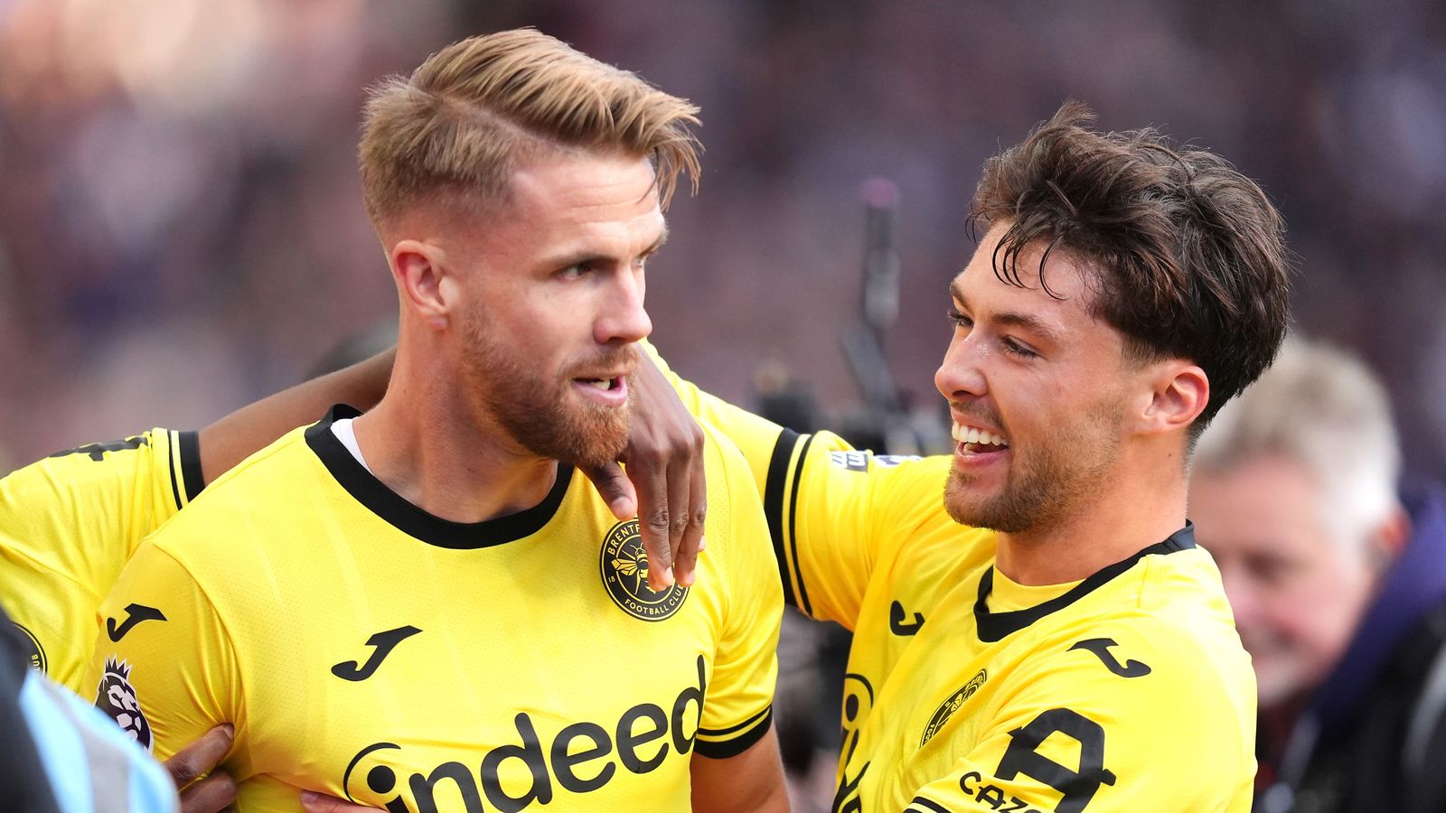 Brentford’s Kristoffer Ajer and Aaron Hickey celebrate at Villa Park